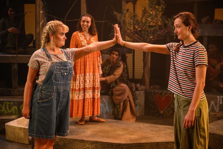 Lola Shalam and Nora Knop holding hands with Amber Gadd and Arinder Sadhra in the background